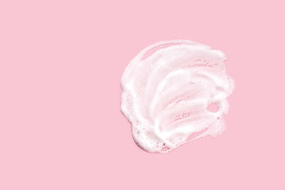 Close-up of ice cream against pink background