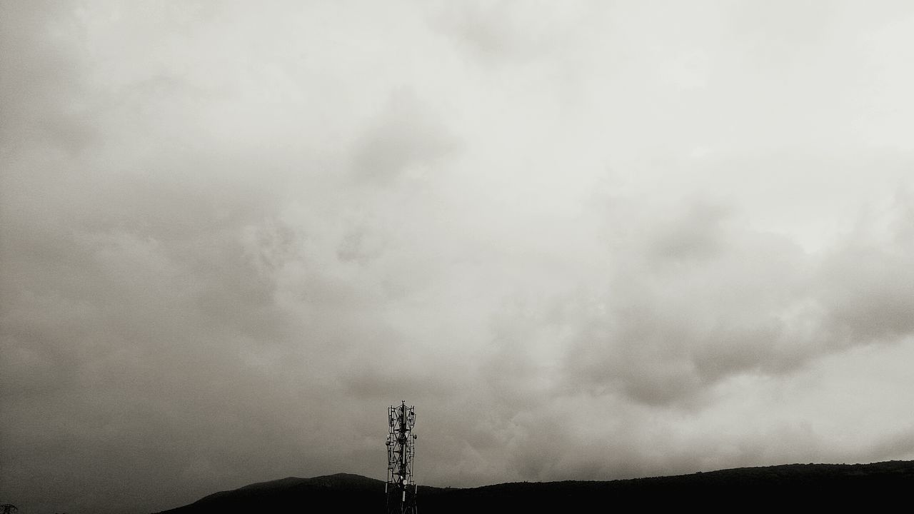 sky, cloud - sky, low angle view, nature, silhouette, outdoors, tranquility, tranquil scene, communication, mountain, day, scenics, no people, beauty in nature, electricity pylon