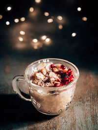 Close-up of mug with asure aka noah's pudding, an islamic dessert with legumes, nuts and dried fruit