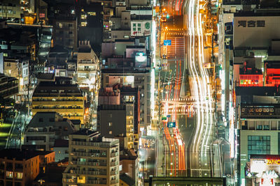 Illuminated modern buildings in city at night