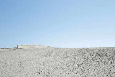 Scenic view of desert against clear sky