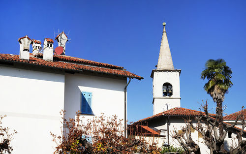 Low angle view of traditional building against clear blue sky