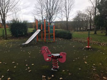 View of playground against sky in park