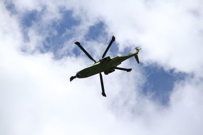 Low angle view of airplane flying in sky