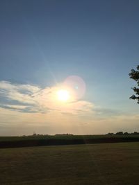Scenic view of field against sky during sunset