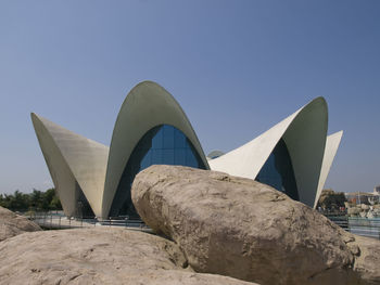 Close-up of modern building against blue sky