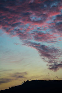 Low angle view of dramatic sky during sunset