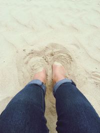 Low section of woman standing on tiled floor