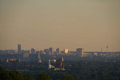 High angle view of buildings against sky during sunset