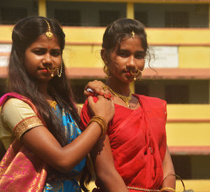 Portrait of happy girls standing outdoors