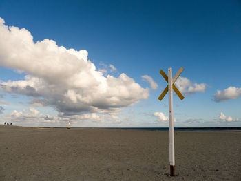 Scenic view of beach against blue sky