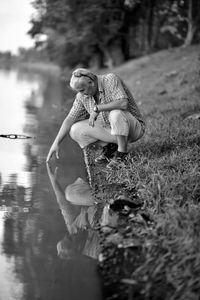 Full length portrait of woman standing in water