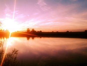 Scenic view of sunset over lake