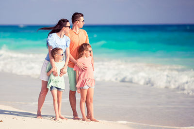 Full length of woman at beach against sky