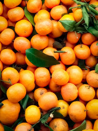 Full frame shot of oranges at market stall