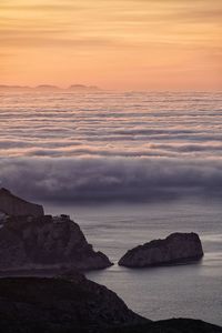 Scenic view of sea against sky during sunset