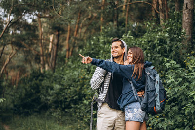 Young couple smiling in forest