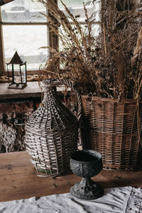 Close-up of wicker basket on tree trunk