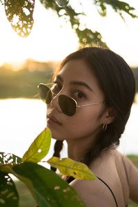 Portrait of young woman wearing sunglasses