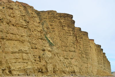 Low angle view of old ruins against sky