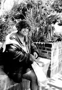 Portrait of young man sitting outdoors