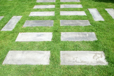 High angle view of stone wall in lawn