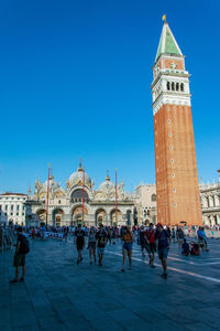 Group of people in front of historic building in venice 