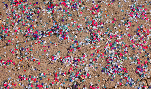 High angle view of multi colored confetti