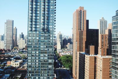 Modern buildings in city against sky