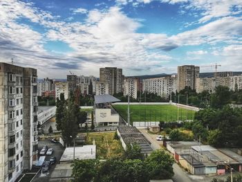 High angle view of buildings in city against sky