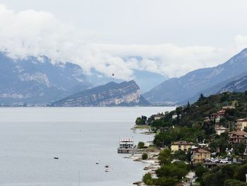 Scenic view of sea and mountains against sky