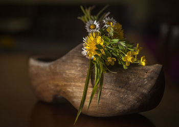 Close-up of yellow flower on table