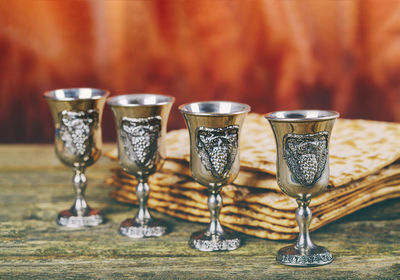 Close-up of wine glasses on table