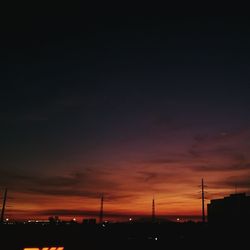 Silhouette of trees against sky at sunset