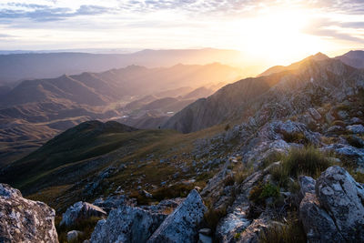 Scenic view of mountains against sky during sunrise