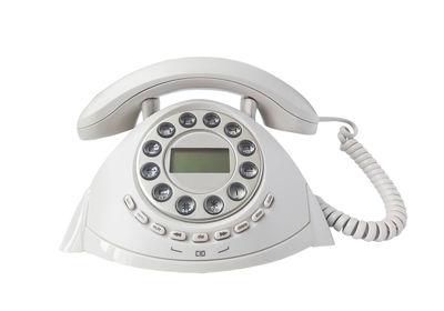 Close-up of telephone booth against white background