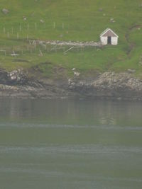 Scenic view of lake by building