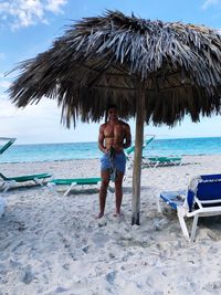 Rear view of man standing on beach