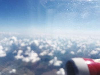 Close-up of airplane wing against sky