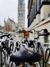 Close-up of bicycle perching on city