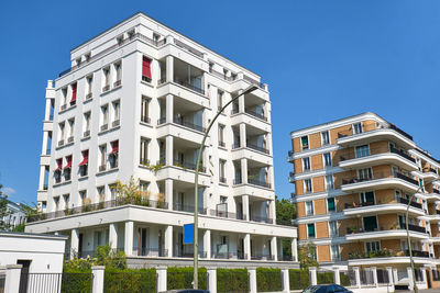 Low angle view of buildings against blue sky