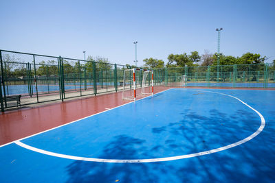 Scenic view of swimming pool against clear blue sky