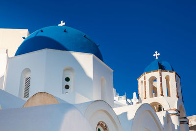 Traditional architecture of the churches of the oia city in santorini island