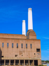 Low angle view of building against blue sky