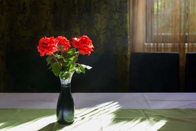 Close-up of red flower on table