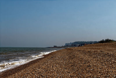 Scenic view of beach against clear sky