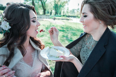 Young woman holding ice cream