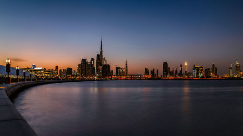 Illuminated buildings in city at night