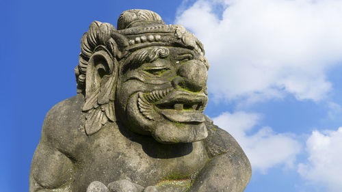 Low angle view of statue against sky