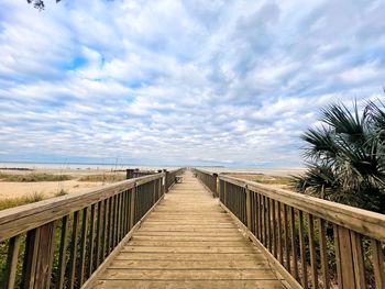 Pier over sea against sky